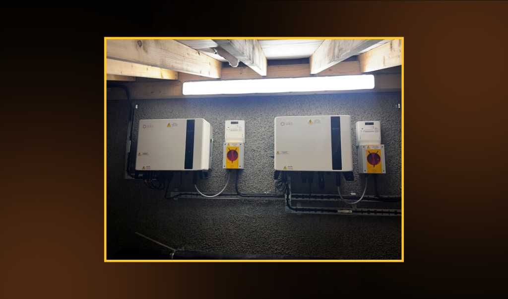 Alt-text: Two 3-phase, commercial, hybrid Solis inverters installed by First Class Solar at a commercial clothing supplier in Coleraine, Northern Ireland.