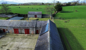 Solar panels fitted by First Class Solar on a farm building in Northern Ireland under G99 Fast Track.